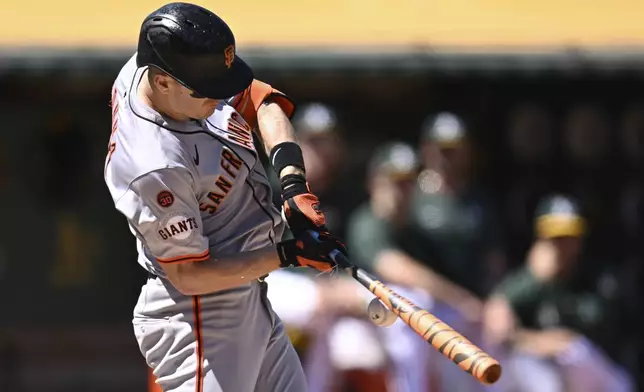 San Francisco Giants' Mark Canha cracks his bat while hitting against the Oakland Athletics during the sixth inning of a baseball game Sunday, Aug. 18, 2024, in Oakland, Calif. (AP Photo/Eakin Howard)