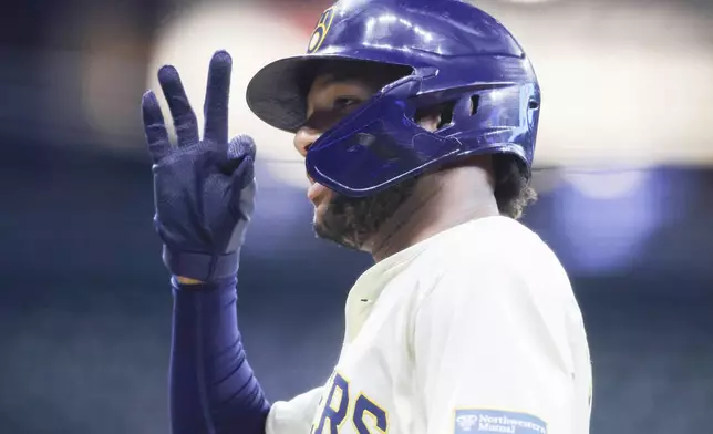 Milwaukee Brewers' Jackson Chourio reacts after his run-scoring single during the fifth inning of a baseball game against the San Francisco Giants, Wednesday, Aug. 28, 2024, in Milwaukee. (AP Photo/Jeffrey Phelps)