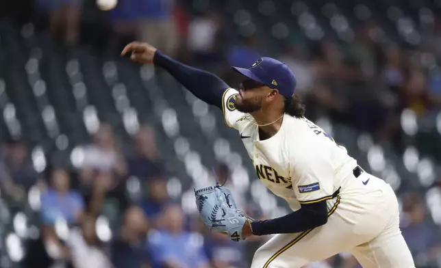 Milwaukee Brewers pitcher Freddy Peralta (51) throws to the San Francisco Giants during the first inning of a baseball game Wednesday, Aug. 28, 2024, in Milwaukee. (AP Photo/Jeffrey Phelps)