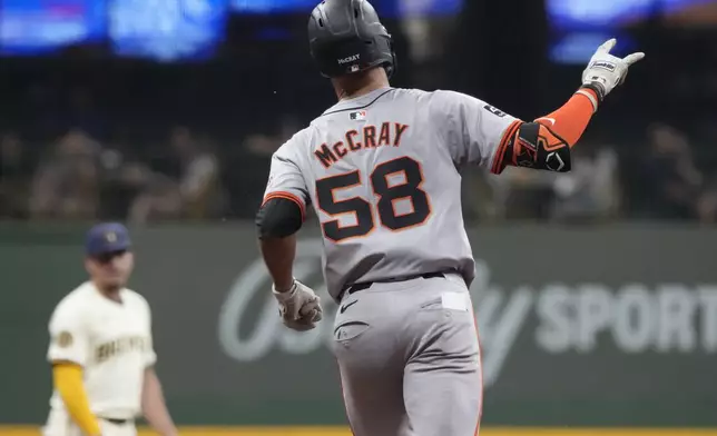 San Francisco Giants' Grant McCray reacts after hitting a home run during the fifth inning of a baseball game against the Milwaukee Brewers Tuesday, Aug. 27, 2024, in Milwaukee. (AP Photo/Morry Gash)