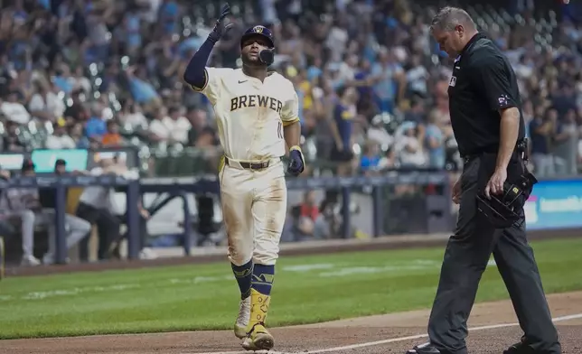 Milwaukee Brewers' Jackson Chourio reacts after hitting a two-run home run during the third inning of a baseball game against the San Francisco Giants Tuesday, Aug. 27, 2024, in Milwaukee. (AP Photo/Morry Gash)