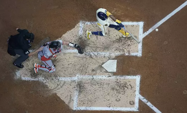 Milwaukee Brewers' Jackson Chourio hits a two-run home run during the third inning of a baseball game against the San Francisco Giants Tuesday, Aug. 27, 2024, in Milwaukee. (AP Photo/Morry Gash)