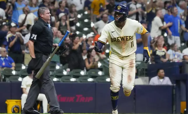 Milwaukee Brewers' Jackson Chourio reacts after hitting a two-run home run during the third inning of a baseball game against the San Francisco Giants Tuesday, Aug. 27, 2024, in Milwaukee. (AP Photo/Morry Gash)