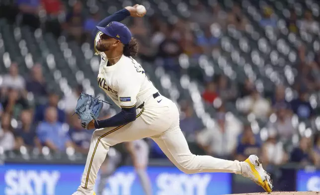 Milwaukee Brewers pitcher Freddy Peralta (51) throws to the San Francisco Giants during the first inning of a baseball game Wednesday, Aug. 28, 2024, in Milwaukee. (AP Photo/Jeffrey Phelps)