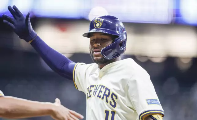 Milwaukee Brewers' Jackson Chourio reacts after his run-scoring single during the fifth inning of a baseball game against the San Francisco Giants, Wednesday, Aug. 28, 2024, in Milwaukee. (AP Photo/Jeffrey Phelps)