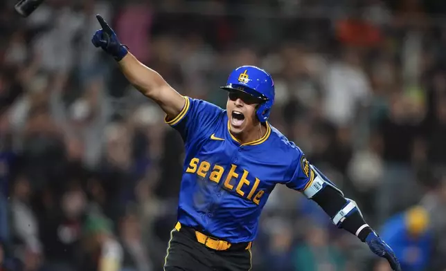 Seattle Mariners' Leo Rivas reacts to hitting a game-winning single against the San Francisco Giants during the 10th inning of a baseball game for a 6-5 win, Friday, Aug. 23, 2024, in Seattle. (AP Photo/Lindsey Wasson)