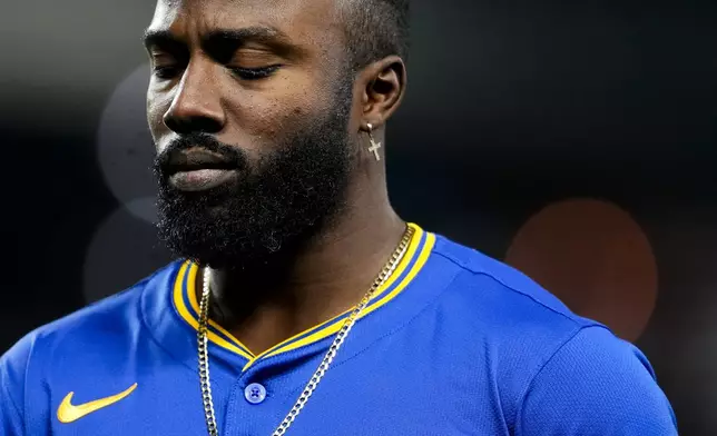 Seattle Mariners' Randy Arozarena reacts after popping out against the San Francisco Giants with the bases loaded to end the third inning of a baseball game, Friday, Aug. 23, 2024, in Seattle. (AP Photo/Lindsey Wasson)