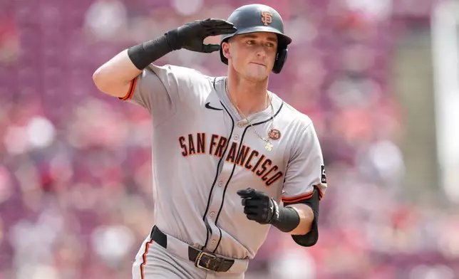 San Francisco Giants' Tyler Fitzgerald rounds the bases after hitting a two-run home run during the eighth inning of a baseball game against the Cincinnati Reds, Sunday, Aug. 4, 2024, in Cincinnati. (AP Photo/Jeff Dean)