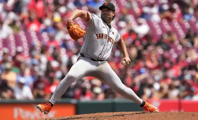 San Francisco Giants pitcher Robbie Ray throws during the third inning of a baseball game against the Cincinnati Reds, Sunday, Aug. 4, 2024, in Cincinnati. (AP Photo/Jeff Dean)