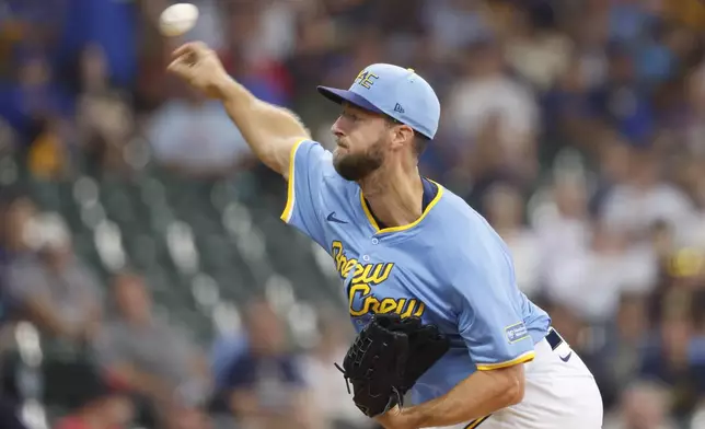 Milwaukee Brewers starting pitcher Colin Rea throws to the Cleveland Guardians during the first inning of a baseball game against the Cleveland Guardians, Sunday, Aug. 18, 2024, in Milwaukee. (AP Photo/Jeffrey Phelps)