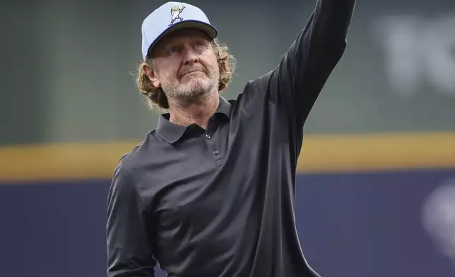 Former Milwaukee Brewers player and Hall of Fame member Robin Yount throws out a ceremonial first pitch before a baseball game against the Cleveland Guardians, Sunday, Aug. 18, 2024, in Milwaukee. (AP Photo/Jeffrey Phelps)