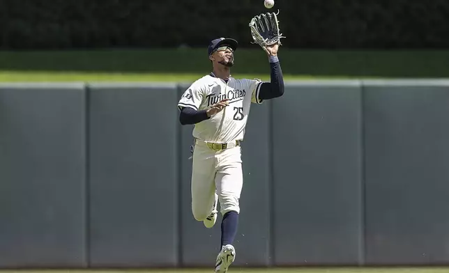 Minnesota Twins outfielder Byron Buxton (25) makes a grab in the outfield for an out in the top of the fifth inning of a baseball game against the Cleveland Guardians in Minneapolis, Minn., Sunday, Aug. 11, 2024. (Elizabeth Flores/Star Tribune via AP)