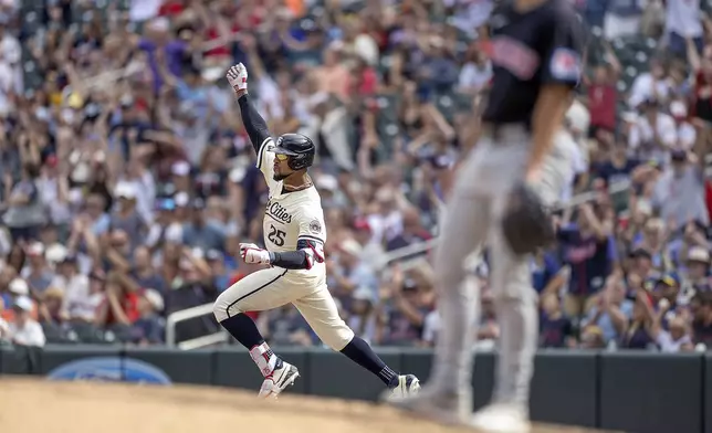 Minnesota Twins' Byron Buxton (25) celebrates a two-run home run in the bottom of the eighth inning of a baseball game against the Cleveland Guardians in Minneapolis, Minn., Sunday, Aug. 11, 2024. (Elizabeth Flores/Star Tribune via AP)