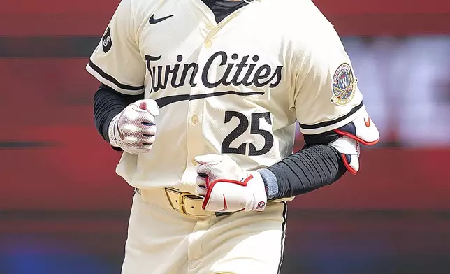 Minnesota Twins' Byron Buxton (25) celebrates a two-run home run in the bottom of the eighth inning of a baseball game against the Cleveland Guardians in Minneapolis, Minn., Sunday, Aug. 11, 2024. (Elizabeth Flores/Star Tribune via AP)