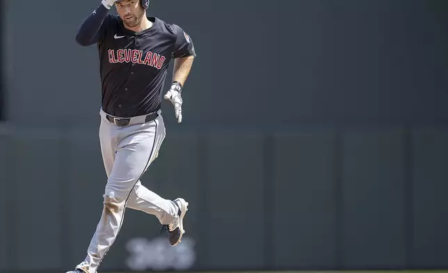 Cleveland Guardians' David Fry (6) shows his stuff as he rounds second after nailing a solo home run in the top of the sixth inning of a baseball game against the Minnesota Twins in Minneapolis, Minn., Sunday, Aug. 11, 2024. (Elizabeth Flores/Star Tribune via AP)