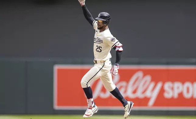 Minnesota Twins' Byron Buxton (25) celebrates a two-run home run in the bottom of the eighth inning of a baseball game against the Cleveland Guardians in Minneapolis, Minn., Sunday, Aug. 11, 2024. (Elizabeth Flores/Star Tribune via AP)