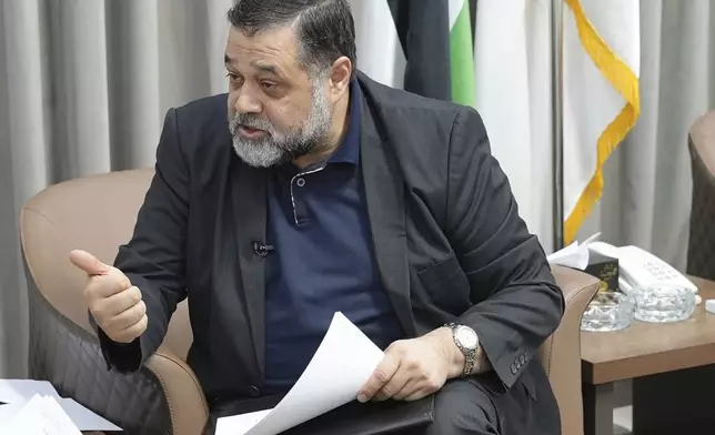 Hamas political official Osama Hamdan speaks during an interview with The Associated Press in Doha, Qatar, Tuesday Aug. 13, 2024. (AP Photo/Malak Harb)