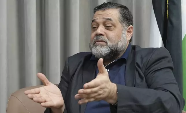 Hamas political official Osama Hamdan speaks during an interview with The Associated Press in Doha, Qatar, Tuesday Aug. 13, 2024. (AP Photo/Malak Harb)