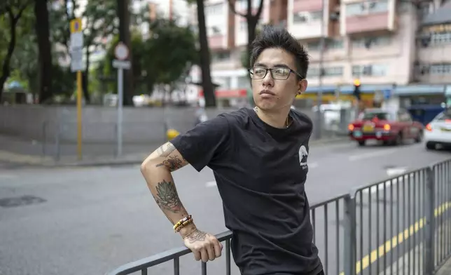 Joker Chan poses for photographs after an interview, in Hong Kong, on June 28, 2024. Chan, 30, was sentenced in 2022 for posts containing slogans like “Liberate Hong Kong, revolution of our times,” which were popularly chanted during massive anti-government protests in the city in 2019. Authorities said such slogans could imply separating Hong Kong from China, a red line for Beijing. (AP Photo/Billy H.C. Kwok)