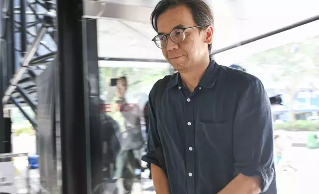 Chung Pui-kuen, the former chief editor of Hong Kong's now shuttered pro-democracy news outlet Stand News, arrivies at the Wanchai District Court ahead of a verdict in a landmark sedition trial in Hong Kong on Thursday, Aug. 29, 2024. (AP Photo/Billy H.C. Kwok)