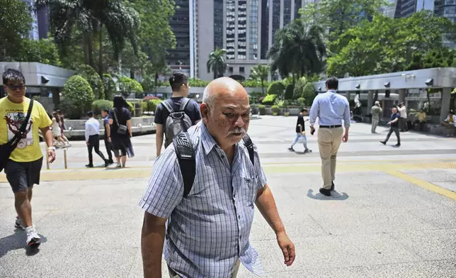 Pro-democracy activist Bull Tsang Kin-shing arrives at the district court ahead of the verdict on Chung Pui-kuen, the ex-chief editor of the now shuttered Stand News online outlet and his colleague Patrick Lam, former acting chief editor, in Hong Kong on Thursday, Aug. 29, 2024. (AP Photo/Billy H.C. Kwok)