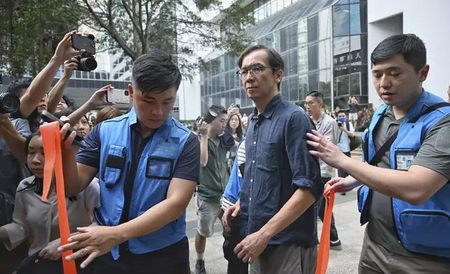 Chung Pui-kuen, the former chief editor of Hong Kong's now-shuttered outlet Stand News, walks outside on bail after he was found guilty in a landmark sedition trial under a colonial-era law, in Wanchai District Court in Hong Kong on Thursday, Aug. 29, 2024. (AP Photo/Billy H.C. Kwok)