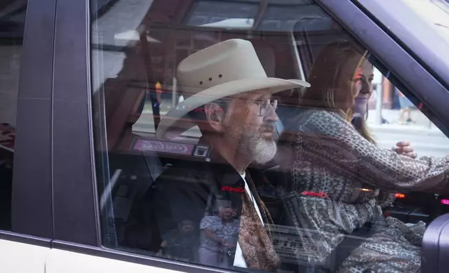 Mimi Fischer, right, and her father, the Rev. Ron Blakely, leave Robert’s Western World after the Gospel Hour held at the Nashville honky tonk on Sunday, July 28, 2024, in Nashville, Tenn. (AP Photo/Luis Andres Henao)