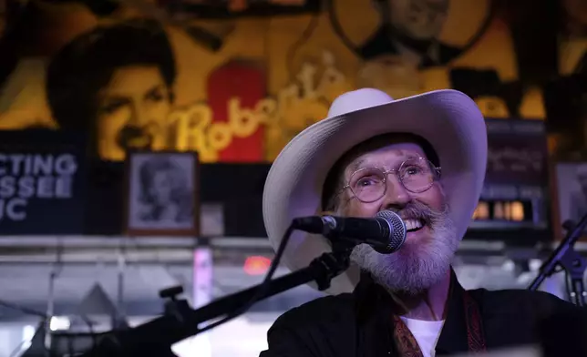 The Rev. Ron Blakely smiles on stage during the Sunday Gospel Hour that he leads at Robert’s Western World honky tonk on Sunday, July 28, 2024, in Nashville, Tenn. (AP Photo/Luis Andres Henao)