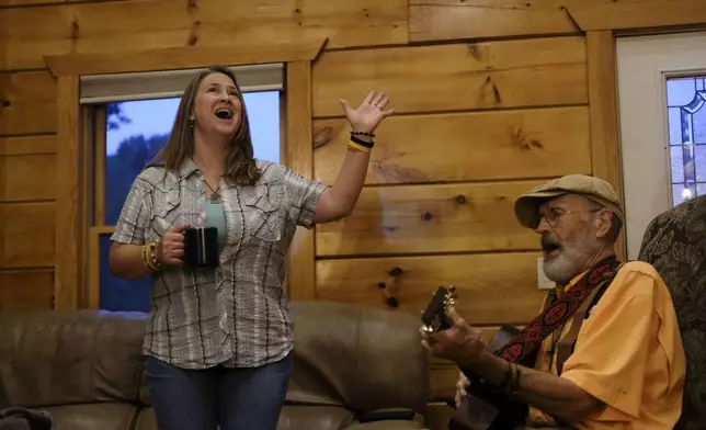 Mimi Fischer and her father, the Rev. Ron Blakely, rehearse for their Sunday Gospel Hour at Robert’s Western World honky tonk on Saturday, July 27, 2024, at Blakely’s log cabin home near Watertown, Tenn. (AP Photo/Luis Andres Henao)