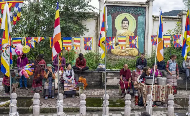 Exiled Tibetans wait to welcome their spiritual leader the Dalai Lama before he arrived in Dharamshala, India, Wednesday, Aug. 28, 2024. (AP Photo/Ashwini Bhatia)