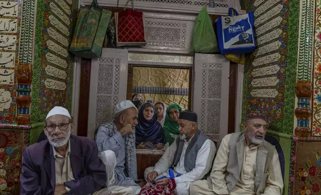 Kashmiri Muslims pray at the shrine of Sufi saint Sheikh Hamzah Makdoom during an annual festival in Srinagar, Indian controlled Kashmir, Friday, Aug. 30, 2024.(AP Photo/Dar Yasin)