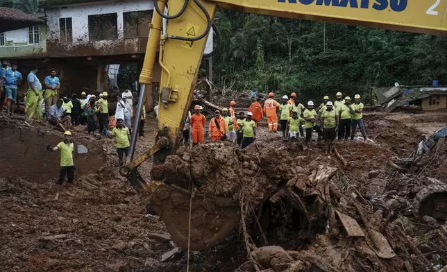 Rescuers search through mud and debris for a third day after landslides set off by torrential rains in Wayanad district, Kerala state, India, Thursday, Aug. 1, 2024. (AP Photo/Rafiq Maqbool)