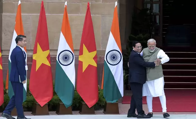 Indian Prime Minister Narendra Modi, right, receives his Vietnamese counterpart Pham Minh Chinh as the latter arrives for talks in New Delhi, India, Thursday, Aug. 1, 2024. (AP Photo)