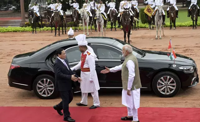 Indian Prime Minister Narendra Modi, right, receives his Vietnamese counterpart Pham Minh Chinh, during a ceremonial reception at the Rashtrapati Bhavan in New Delhi, India, Thursday, Aug. 1, 2024. (AP Photo)