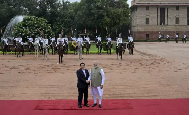 Indian Prime Minister Narendra Modi, right, receives his Vietnamese counterpart Pham Minh Chinh, during a ceremonial reception at the Rashtrapati Bhavan in New Delhi, India, Thursday, Aug. 1, 2024. (AP Photo)