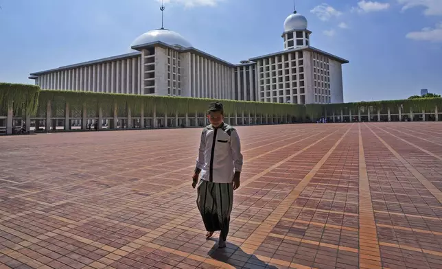 A man walks at Istiqlal Mosque after Friday prayers in Jakarta, Indonesia, Friday, Aug. 9, 2024. (AP Photo/Tatan Syuflana)