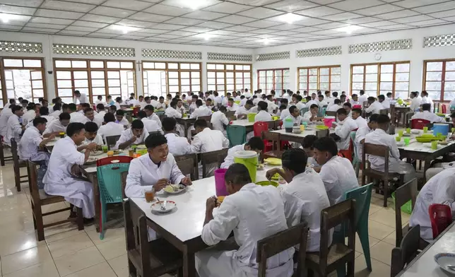 Seminarians have their breakfast at Ritapiret Major Seminary in Maumere, East NusaTenggara province, Indonesia, Friday, Aug. 23, 2024. (AP Photo/Tatan Syuflana)