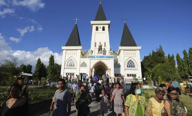 Parishioners leave after a Sunday mass at St. Joseph Cathedral Church in Maumere, East Nusa Tenggara province, Indonesia, Sunday, Aug. 25, 2024. (AP Photo/Tatan Syuflana)