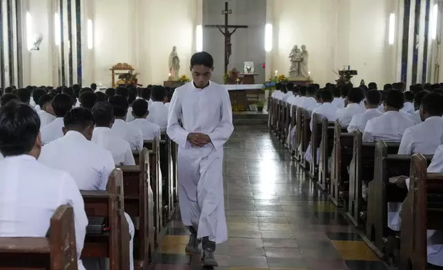 Seminarians attend morning Mass at Ritapiret Major Seminary in Maumere, East NusaTenggara province, Indonesia Friday, Aug. 23, 2024. (AP Photo/Tatan Syuflana)