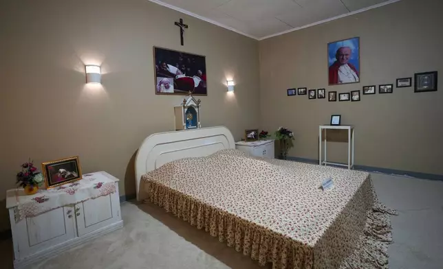 Portraits of Pope John Paul II are displayed in a room where he stayed during his visit in 1989, at Ritapiret Major Seminary in Maumere, East NusaTenggara province, Indonesia, Friday, Aug. 23, 2024. (AP Photo/Tatan Syuflana)