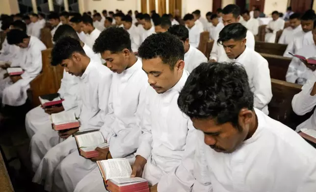 Seminarians read the Bible during a morning Mass at Ritapiret Major Seminary in Maumere, East NusaTenggara province, Indonesia, Friday, Aug. 23, 2024. (AP Photo/Tatan Syuflana)