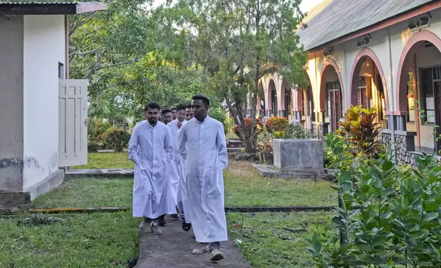 Seminarians walk near their dormitory at Ritapiret Major Seminary in Maumere, East NusaTenggara province, Indonesia, Friday, Aug. 23, 2024. (AP Photo/Tatan Syuflana)