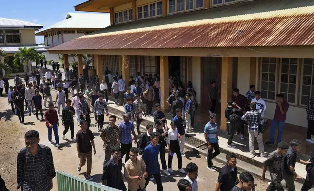 Students walk outside their class at Ledalero Institute of Philosophy and Creative Technology in Maumere, East NusaTenggara province, Indonesia Friday, Aug. 23, 2024. (AP Photo/Tatan Syuflana)