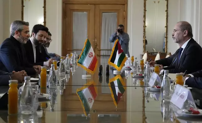 Iran's acting Foreign Minister Ali Bagheri Kani, left, and Jordan's Foreign Minister Ayman Safadi, attend a meeting, in Tehran, Iran, Sunday, Aug. 4, 2024. (AP Photo/Vahid Salemi)