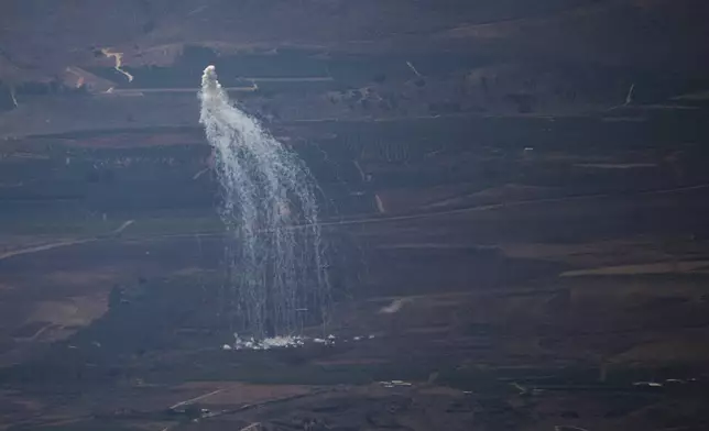 An Israeli shelling hits an area in Lebanon next to the Israeli-Lebanese border at the Galilee region as seen from the Israel-annexed Golan Heights, Monday, Aug. 5, 2024. (AP Photo/Leo Correa)