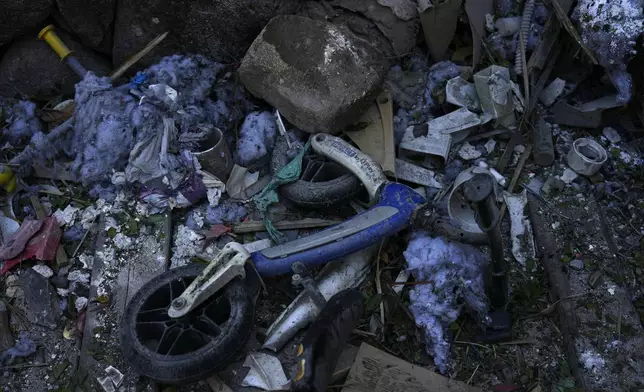 Household items lie destroyed at a home after rockets struck in Katzrin, in the the Israeli-annexed Golan Heights, Wednesday, Aug. 21, 2024. Lebanon's Hezbollah has launched more than 50 rockets, hitting a number of private homes in the area.(AP Photo/Ariel Schalit)