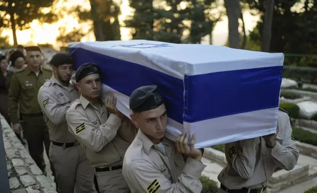 Israeli Navy sailors carry the flag-draped coffin of Petty Officer 1st Class David Moshe Ben Shitrit, who was killed on a Hezbollah attack, during his funeral at the Mount Herzl military cemetery in Jerusalem, Sunday, Aug. 25, 2024. (AP Photo/Ohad Zwigenberg)