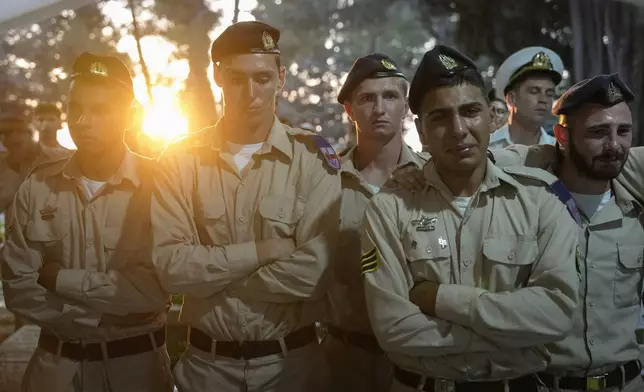 Israeli Navy sailors mourn during the funeral of Petty Officer 1st Class David Moshe Ben Shitrit, who was killed on a Hezbollah attack, at the Mount Herzl military cemetery in Jerusalem, Sunday, Aug. 25, 2024. (AP Photo/Ohad Zwigenberg)