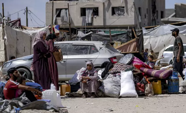 Palestinians displaced by the Israeli air and ground offensive on the Gaza Strip flee from Hamad City, following an evacuation order by the Israeli army to leave parts of the southern area of Khan Younis, Sunday, Aug. 11, 2024. (AP Photo/Abdel Kareem Hana)