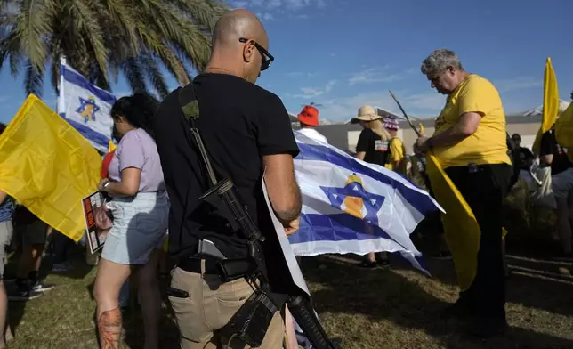 Relatives and friends of hostages held in the Gaza Strip by the Hamas militant group attend a protest in a convoy of vehicles to the Gaza border, in Ashkelon, Wednesday, Aug. 28, 2024. (AP Photo/Tsafrir Abayov)